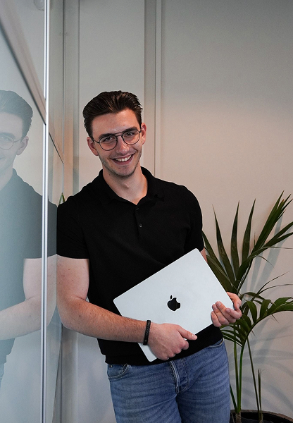 Bas holding his laptop